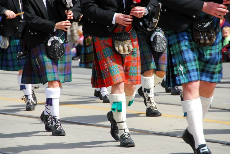 Bagpipers marching in a parade.
